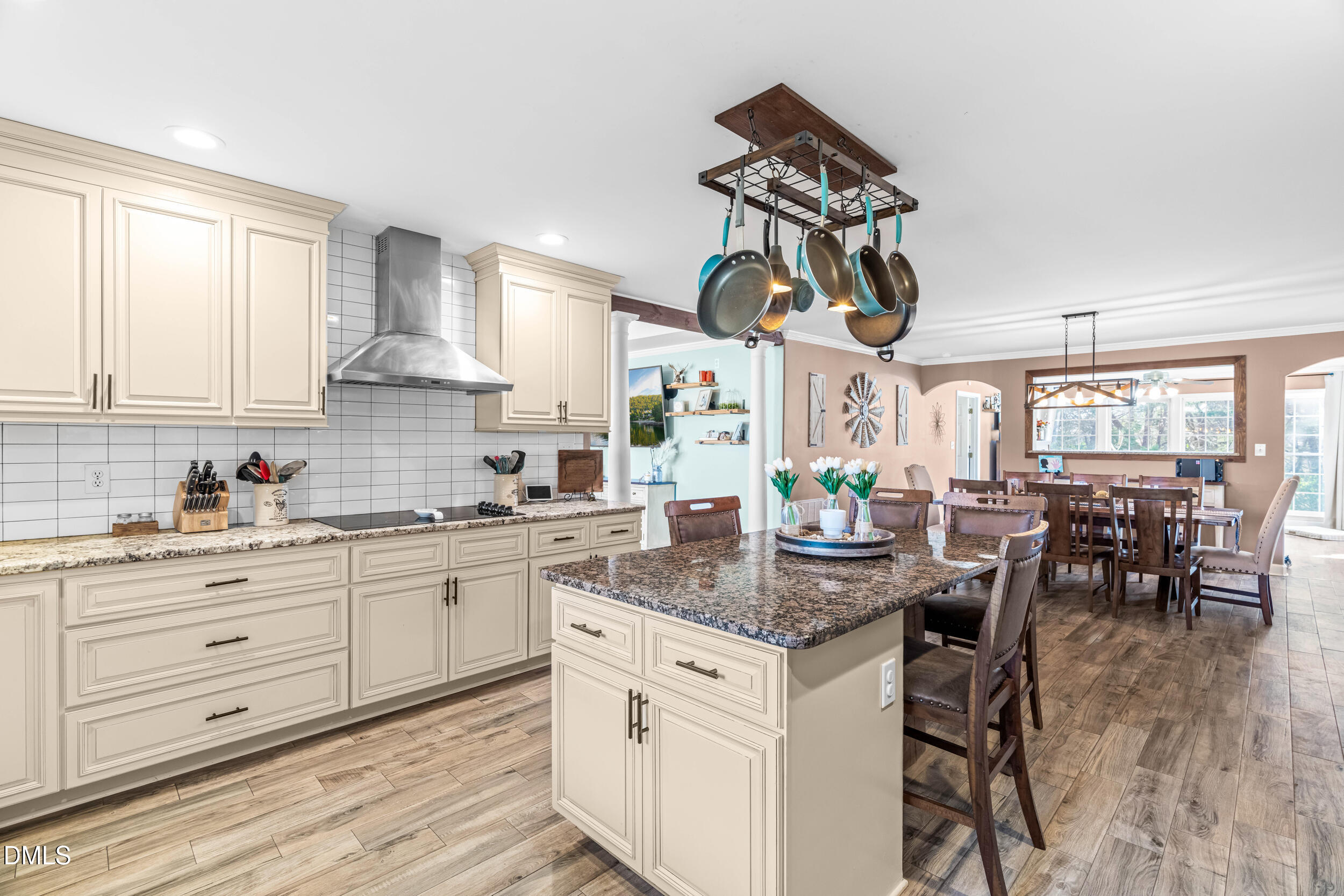 855 Debro Road Kenly, NC 27542 - Photo 13 of 41 a kitchen with stainless steel appliances granite countertop a kitchen island hardwood floor sink stove dining table and chairs