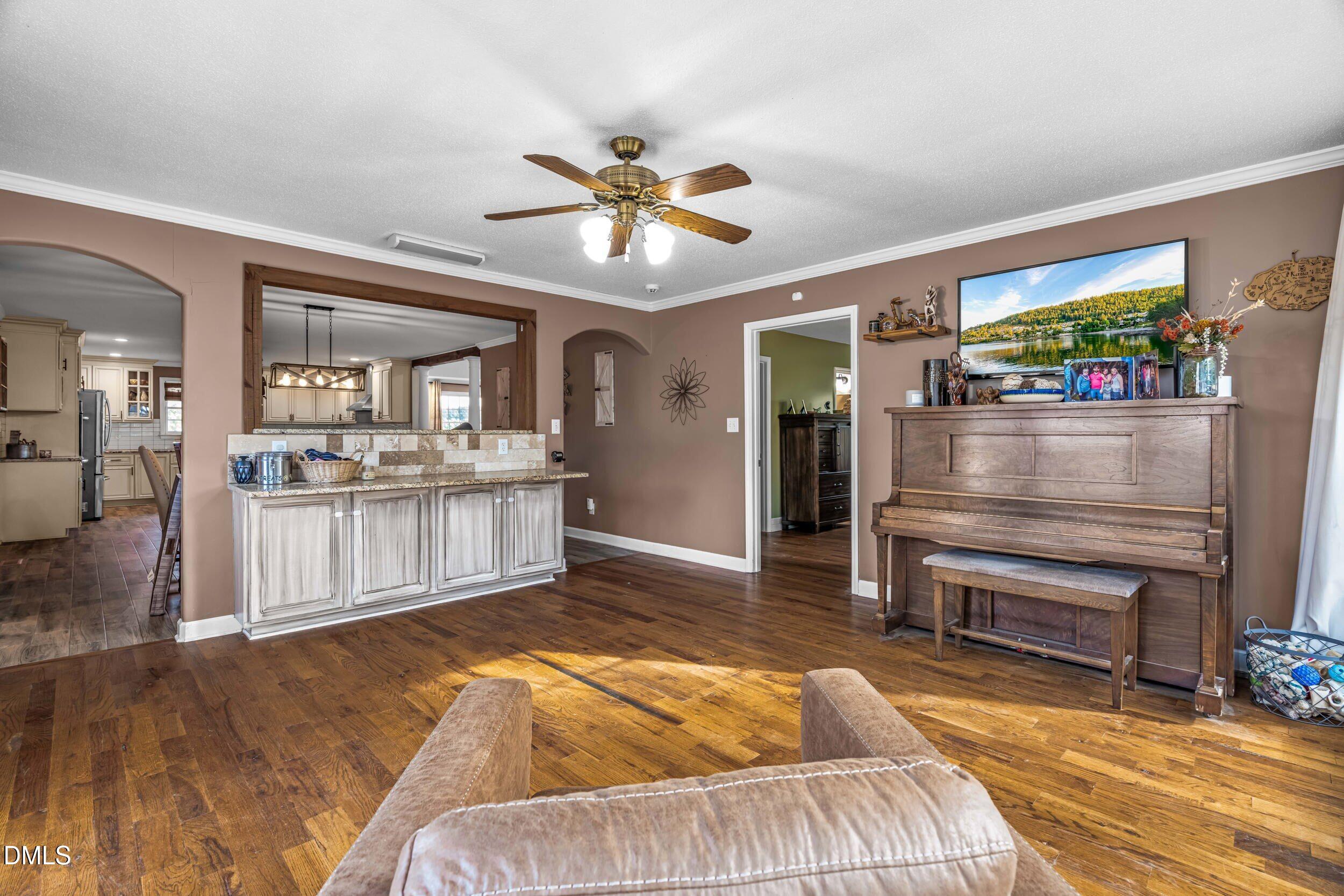 855 Debro Road Kenly, NC 27542 - Photo 21 of 41 a living room with furniture and a dining room