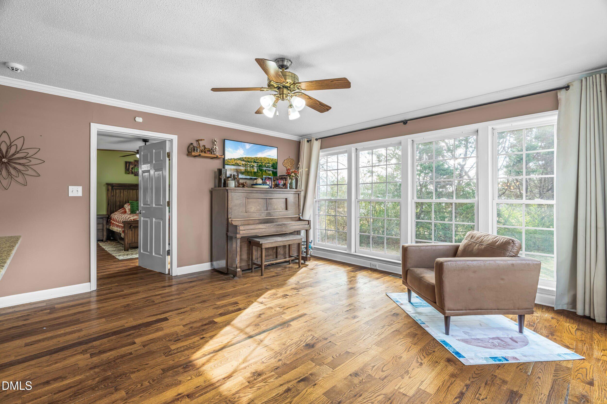 855 Debro Road Kenly, NC 27542 - Photo 22 of 41 a living room with furniture and a large window