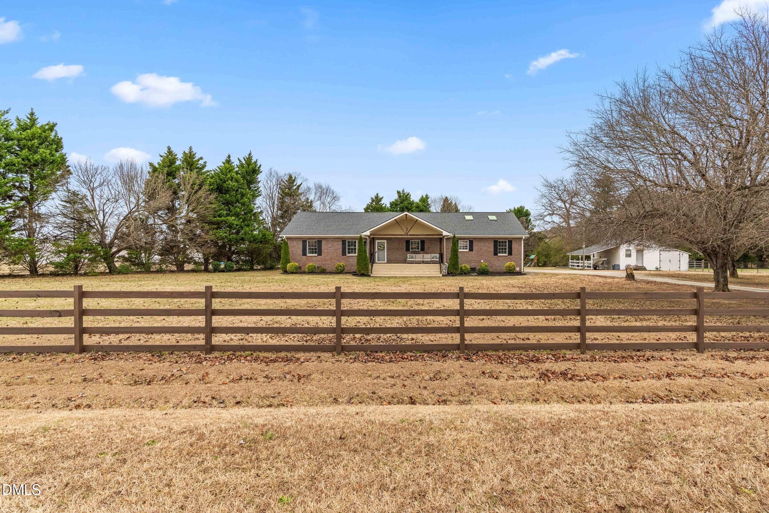 855 Debro Road Kenly, NC 27542 - Photo 3 of 41 a view of a yard with wooden fence