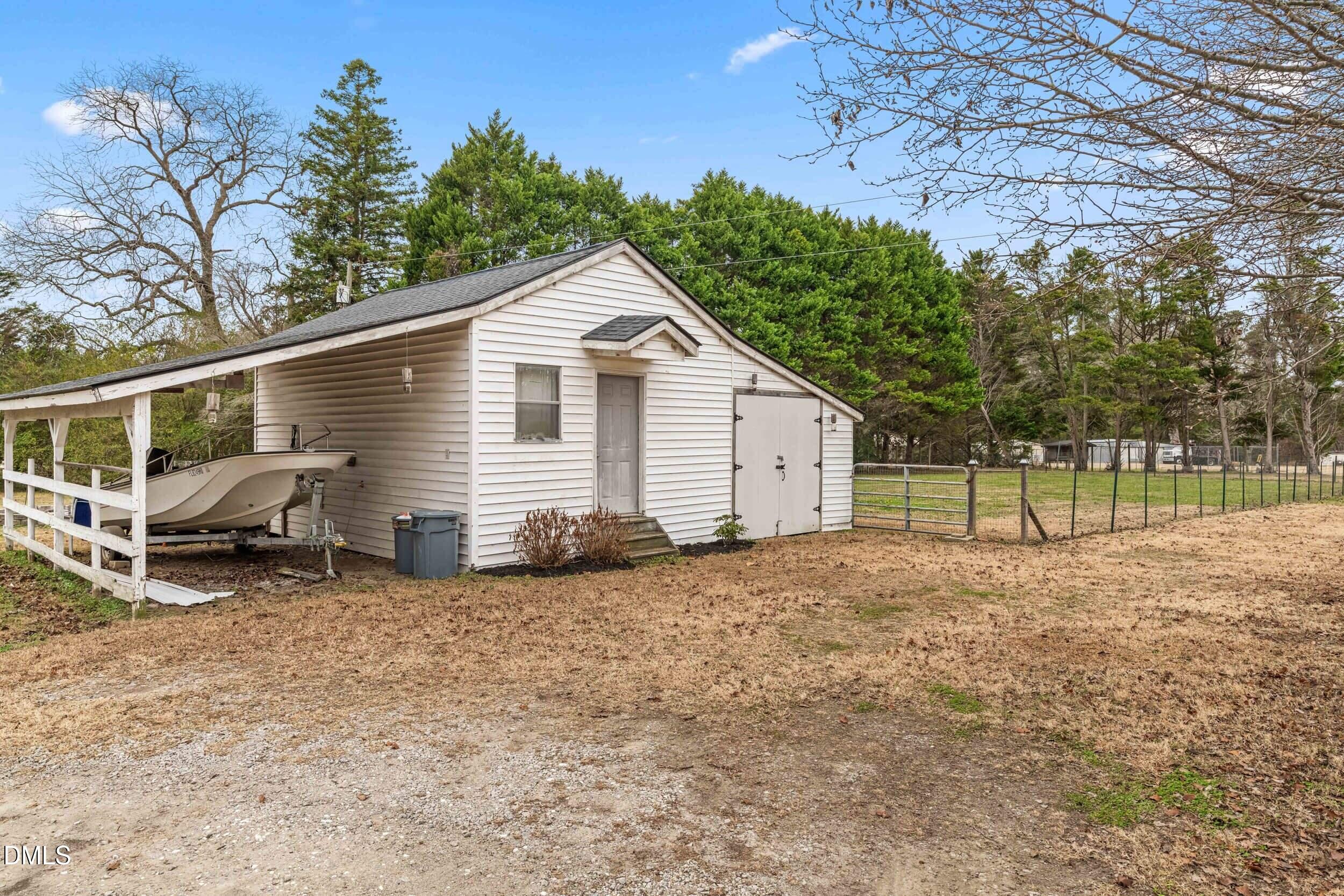 855 Debro Road Kenly, NC 27542 - Photo 40 of 41 a view of a house with a patio