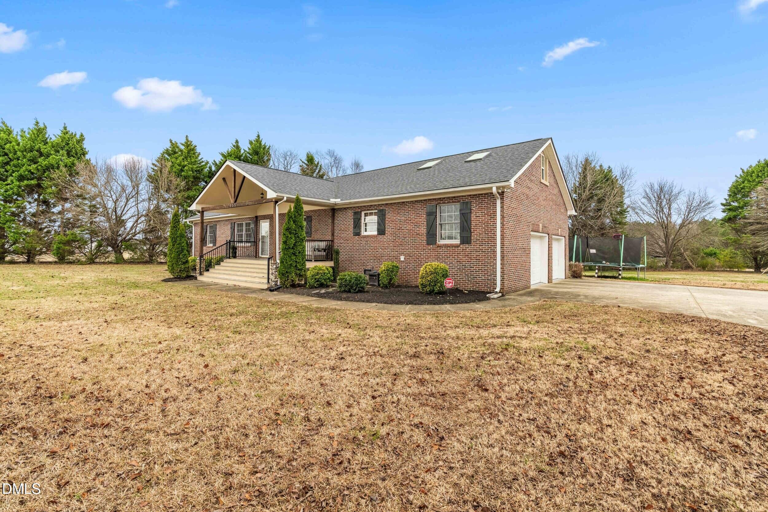 855 Debro Road Kenly, NC 27542 - Photo 7 of 41 a view of a house with a yard