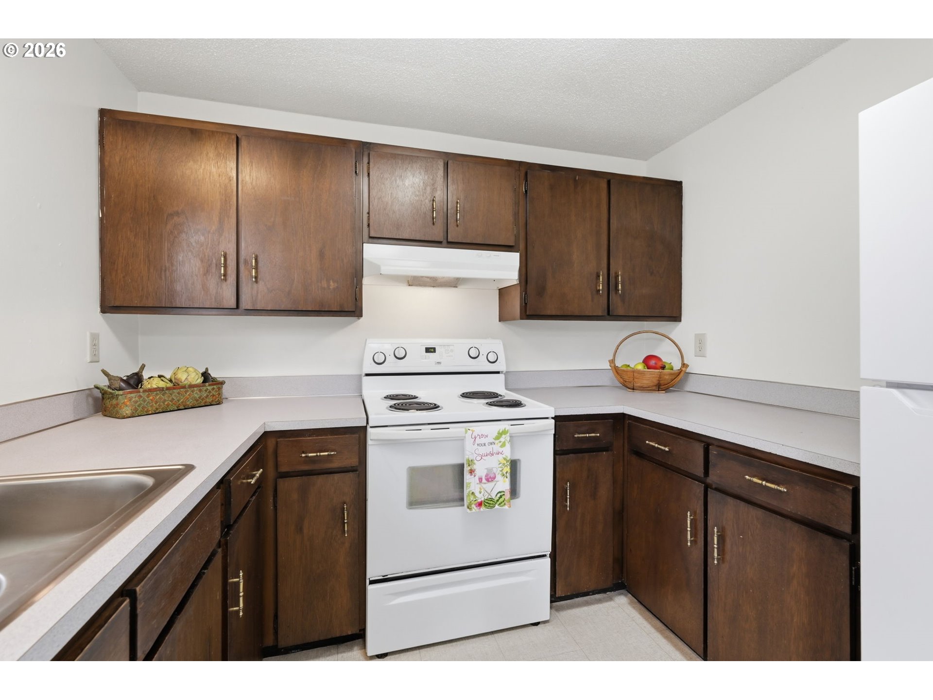 1674 Hayes Street, Unit B Eugene, OR 97402 - Photo 14 of 30 a kitchen with a stove and a sink