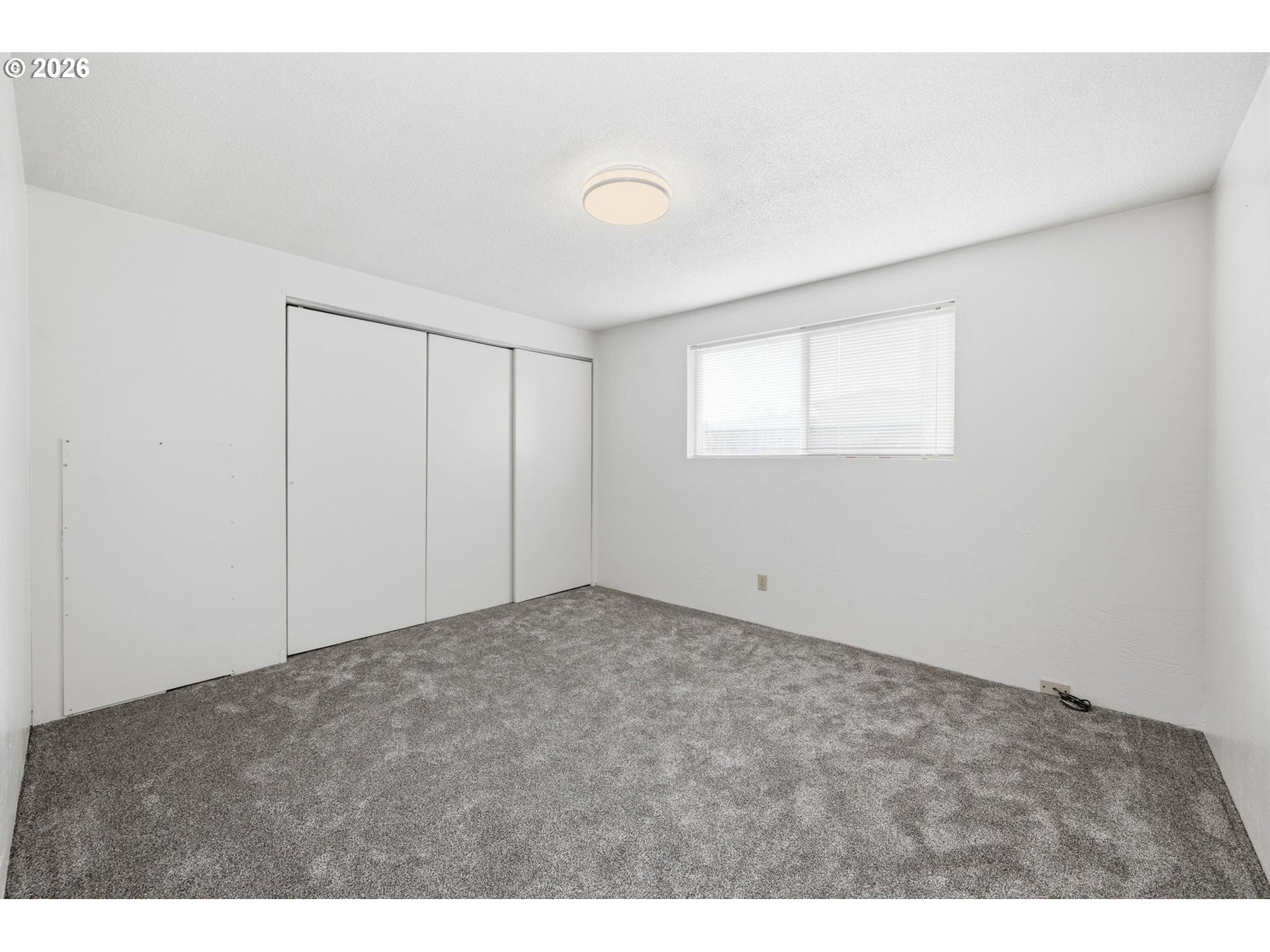 1674 Hayes Street, Unit B Eugene, OR 97402 - Photo 18 of 30 a view of an empty room with a window