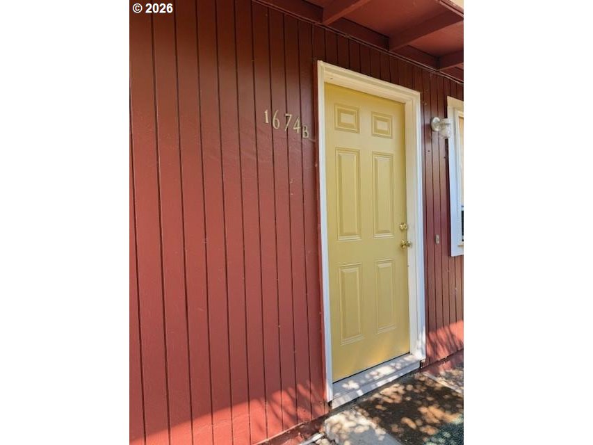 1674 Hayes Street, Unit B Eugene, OR 97402 - Photo 2 of 30 a view of a hallway with wooden floor