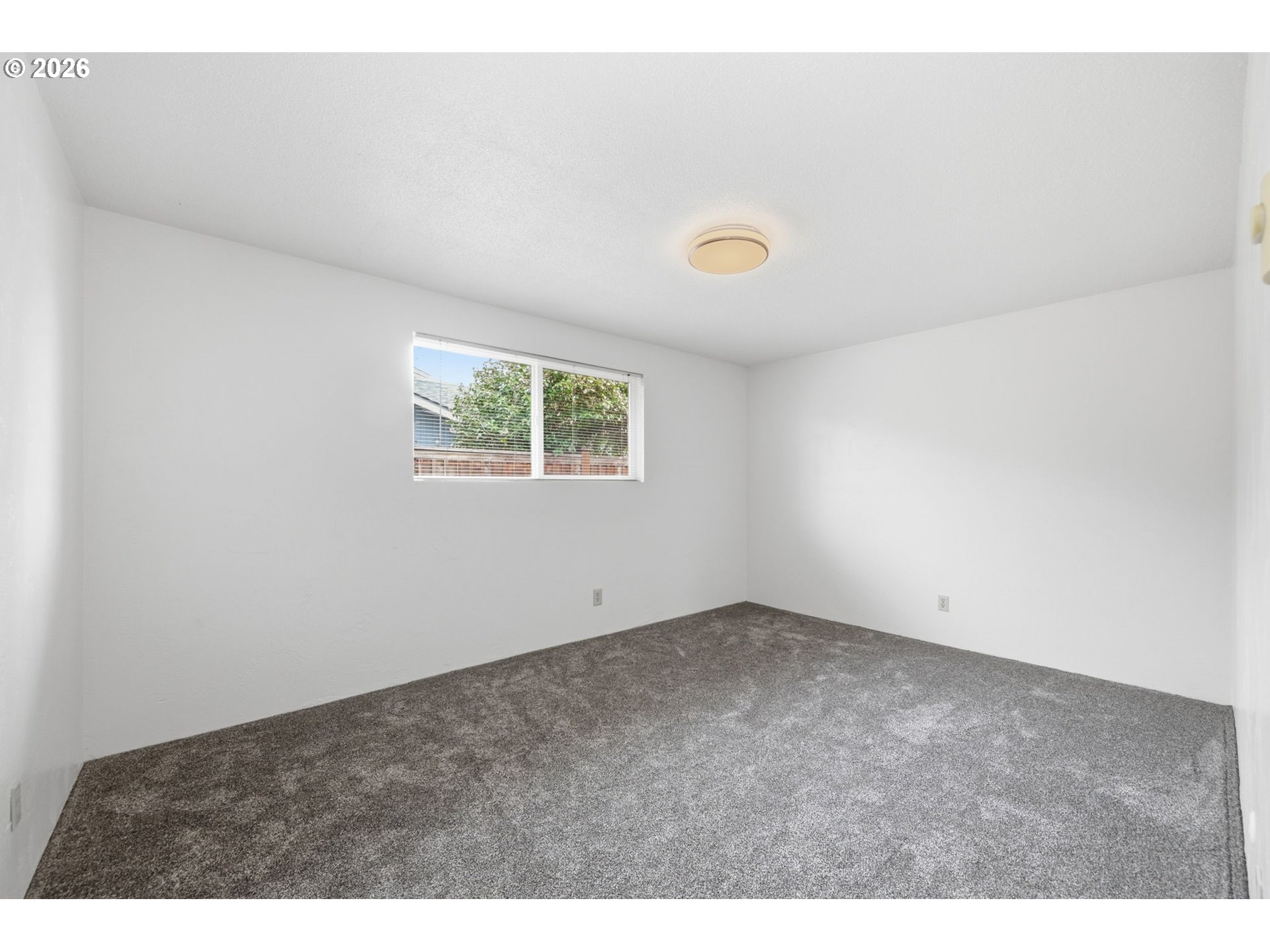 1674 Hayes Street, Unit B Eugene, OR 97402 - Photo 23 of 30 an empty room with windows