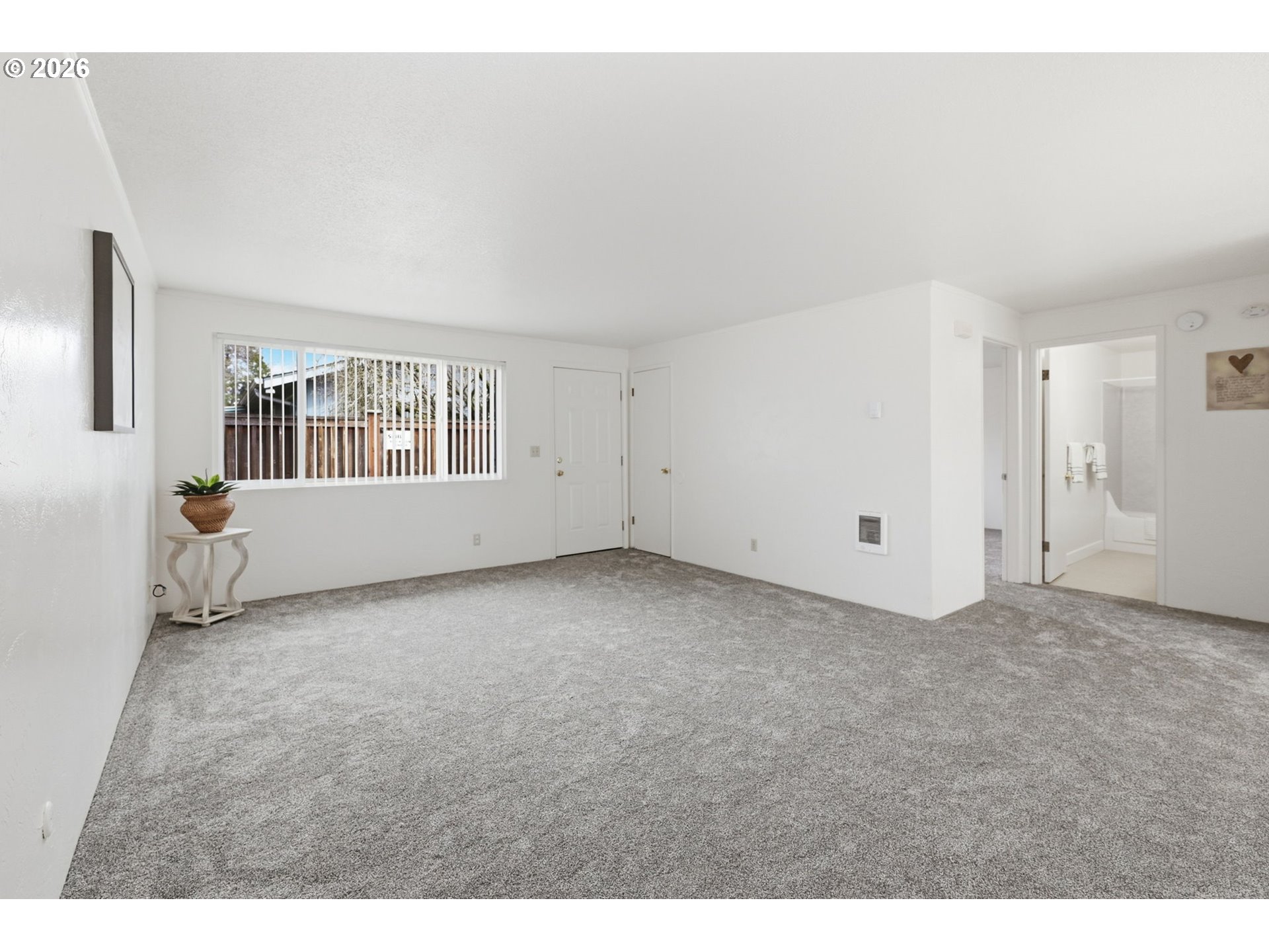 1674 Hayes Street, Unit B Eugene, OR 97402 - Photo 7 of 30 a view of an empty room with a window