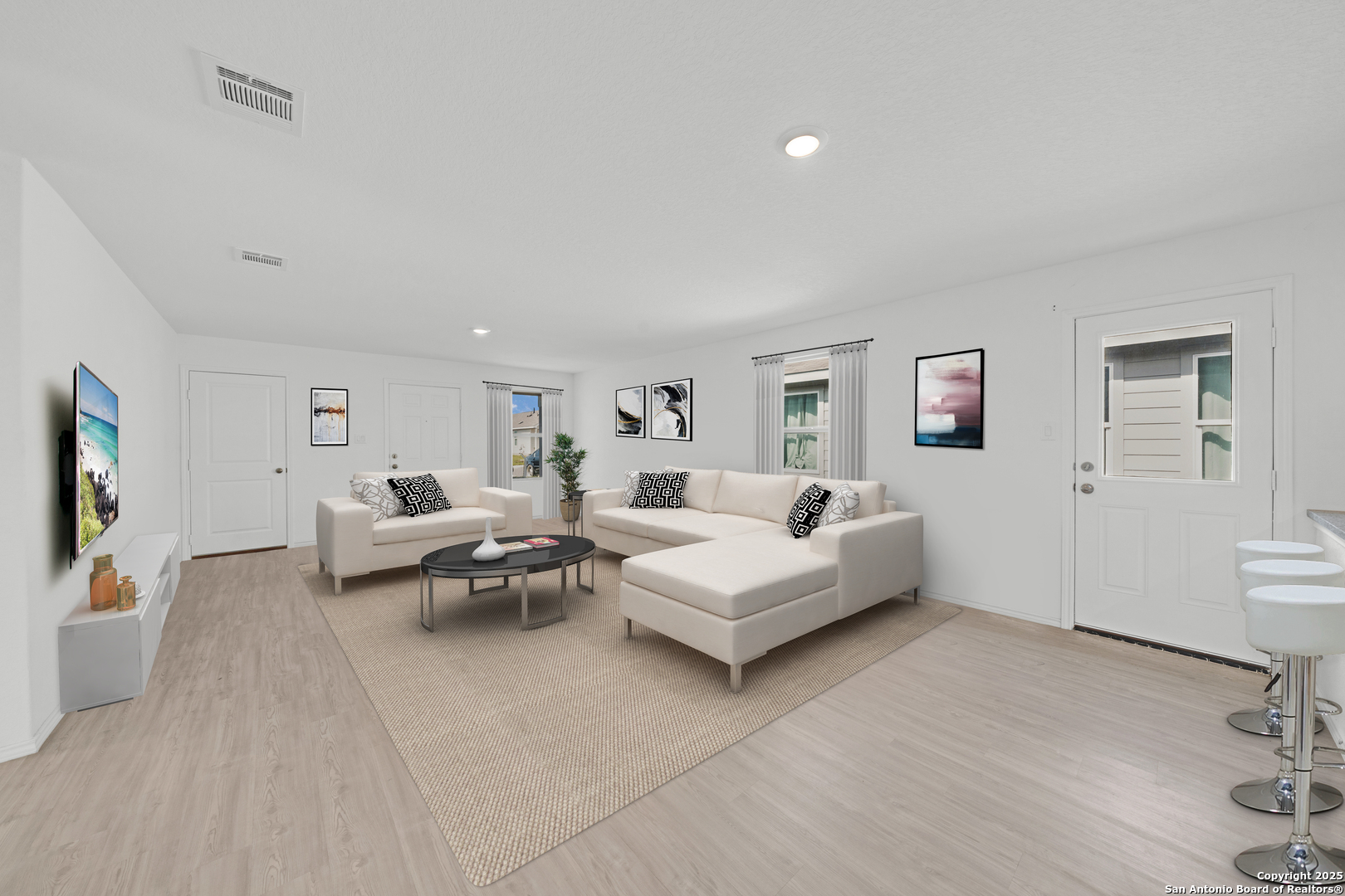 242 Ambush Ridge San Antonio, TX 78220 - Photo 5 of 15 a living room with furniture and a flat screen tv