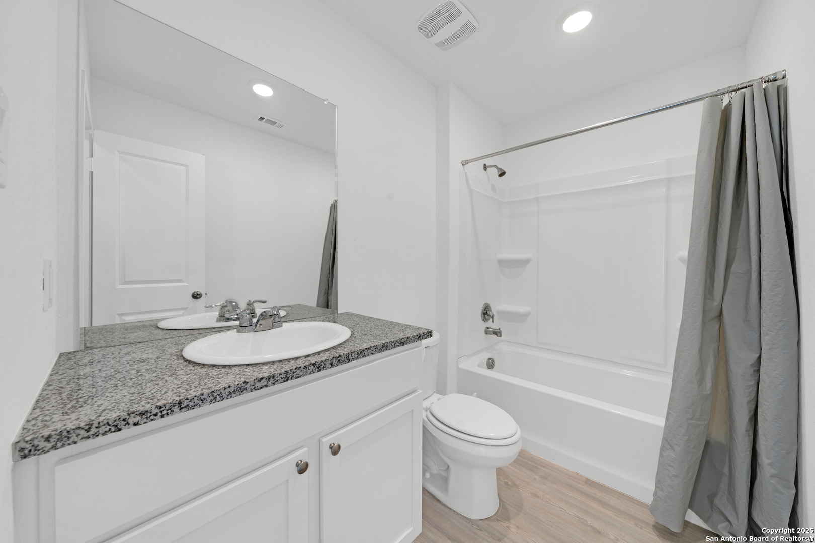 242 Ambush Ridge San Antonio, TX 78220 - Photo 10 of 15 a bathroom with a granite countertop sink toilet and shower