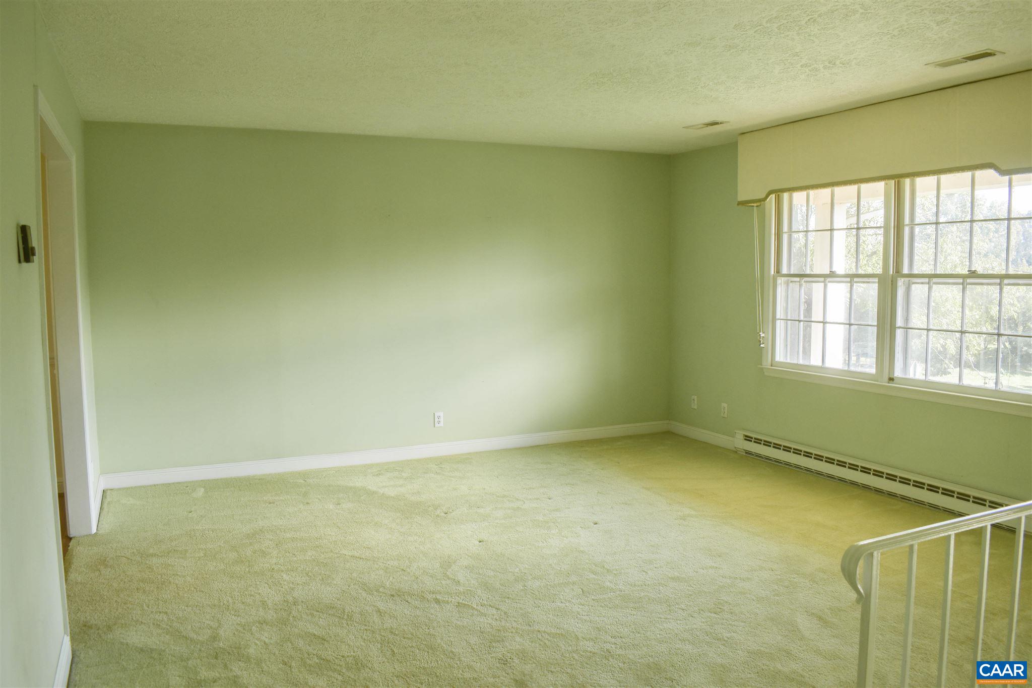 2429 Huntington Road Charlottesville, VA 22901 - Photo 6 of 32 a view of an empty room with a window