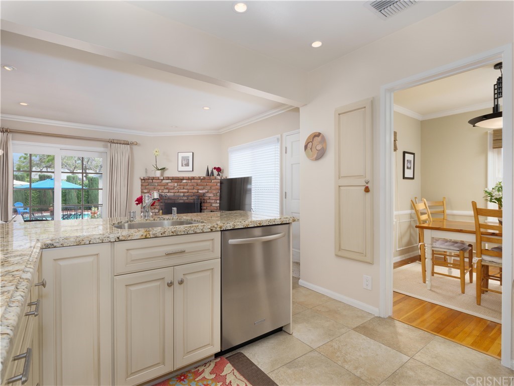 1122 North Niagara Street Burbank, CA 91505 - Photo 15 of 39 a kitchen with white cabinets and sink