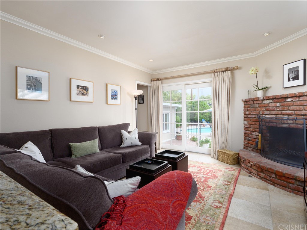 1122 North Niagara Street Burbank, CA 91505 - Photo 17 of 39 a living room with furniture and a fireplace