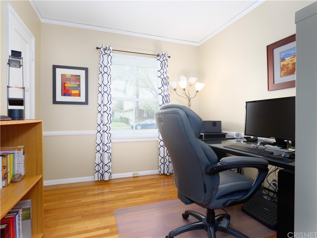 1122 North Niagara Street Burbank, CA 91505 - Photo 20 of 39 a view of a workspace with furniture and a window