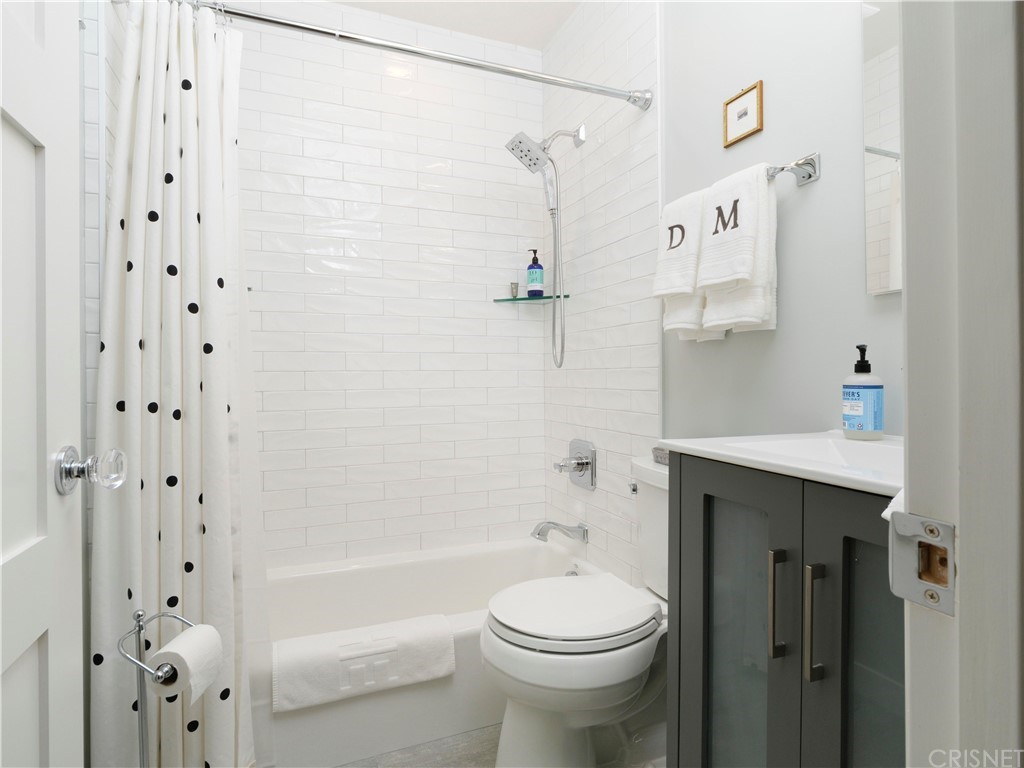 1122 North Niagara Street Burbank, CA 91505 - Photo 21 of 39 a bathroom with a sink a toilet and shower