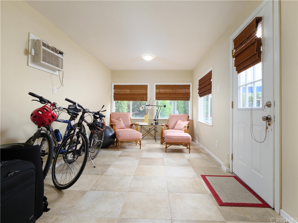 1122 North Niagara Street Burbank, CA 91505 - Photo 27 of 39 a living room with furniture a chandelier and a window