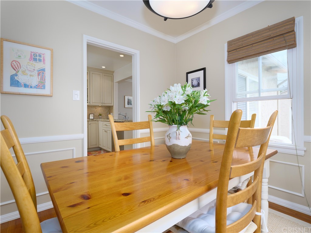 1122 North Niagara Street Burbank, CA 91505 - Photo 8 of 39 a dining room with furniture and wooden floor