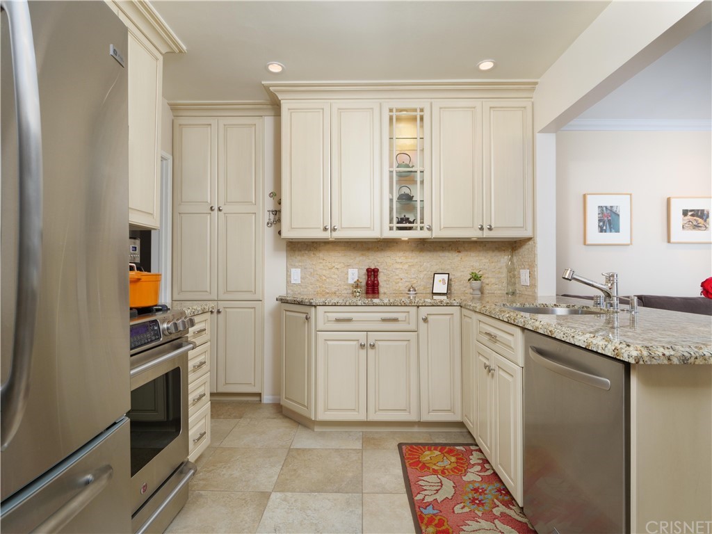 1122 North Niagara Street Burbank, CA 91505 - Photo 10 of 39 a kitchen with a sink stove and cabinets