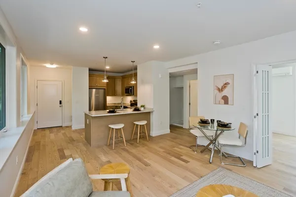 a view of a kitchen and dining room