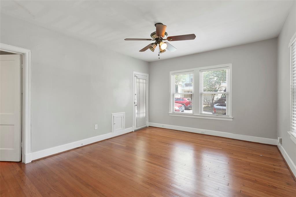 6166 Oram Street Dallas, TX 75214 - Photo 15 of 25 a view of an empty room with wooden floor and a window