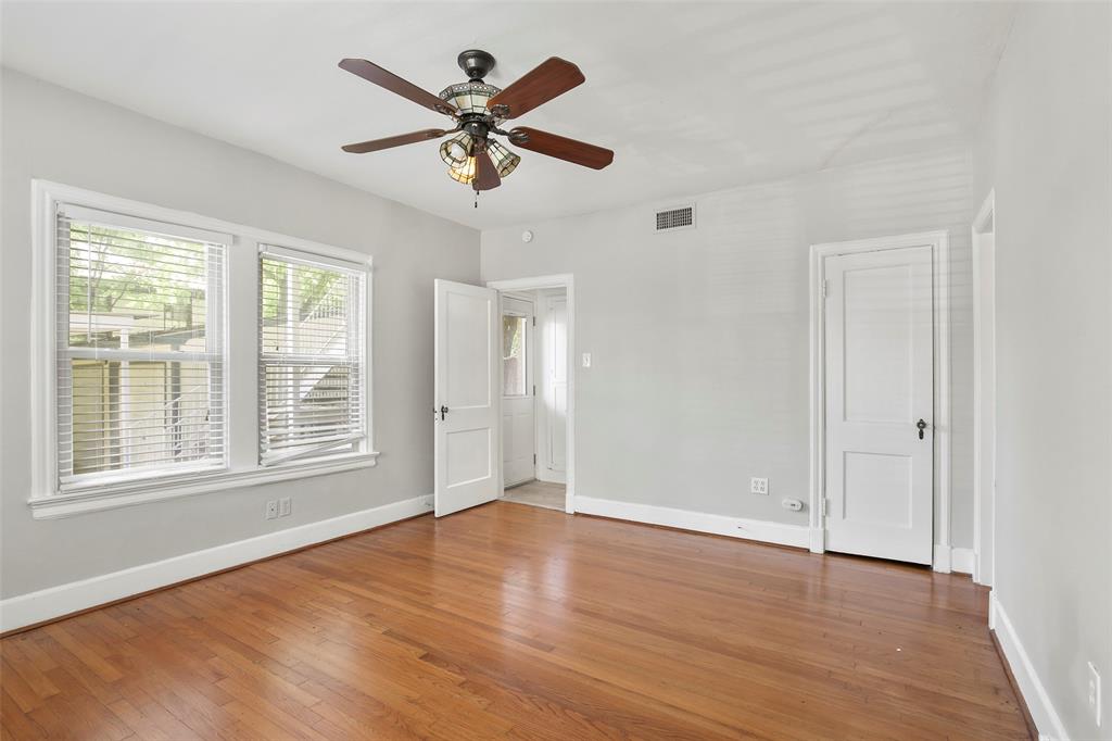 6166 Oram Street Dallas, TX 75214 - Photo 16 of 25 wooden floor in an empty room with a window