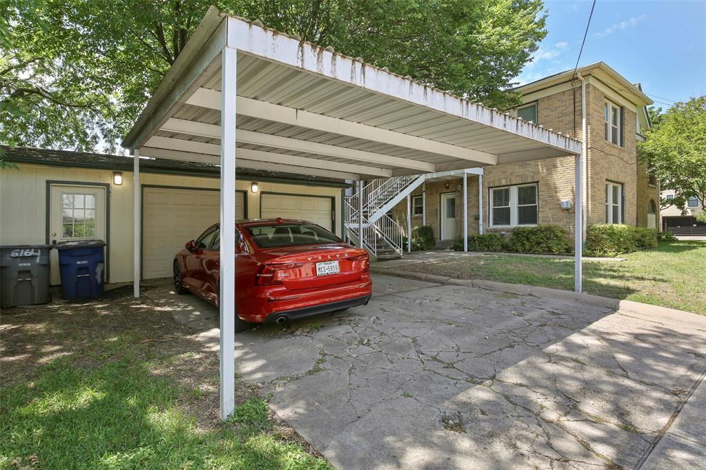 6166 Oram Street Dallas, TX 75214 - Photo 25 of 25 a front view of a house with a garden and plants