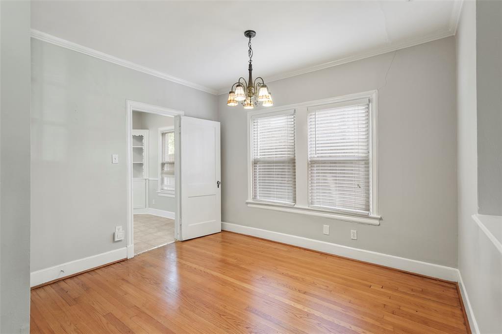 6166 Oram Street Dallas, TX 75214 - Photo 8 of 25 a view of a room with wooden floor and windows