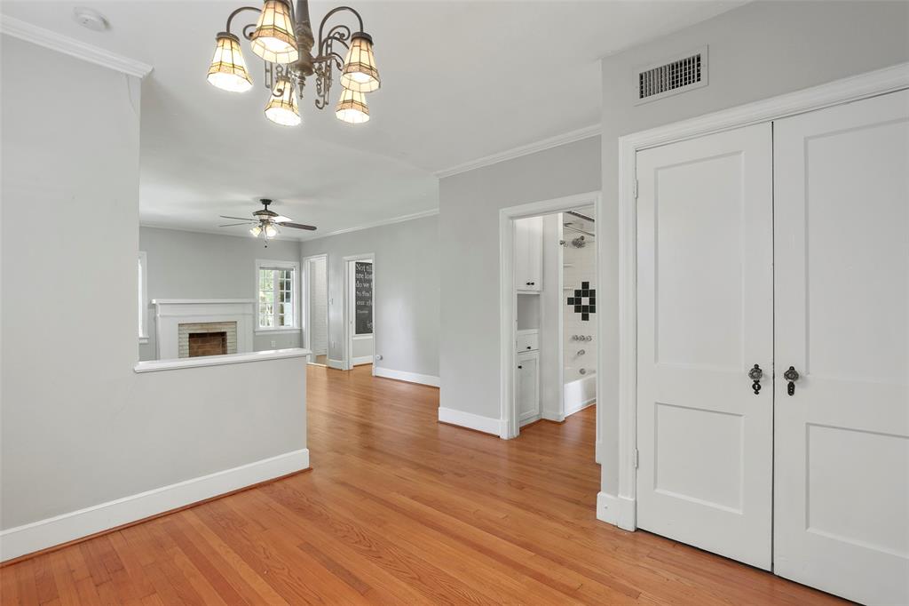 6166 Oram Street Dallas, TX 75214 - Photo 9 of 25 wooden floor in an empty room with a window