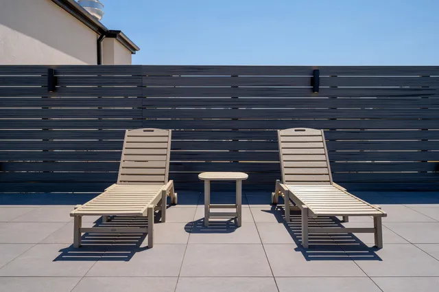 a terrace with outdoor seating and city view