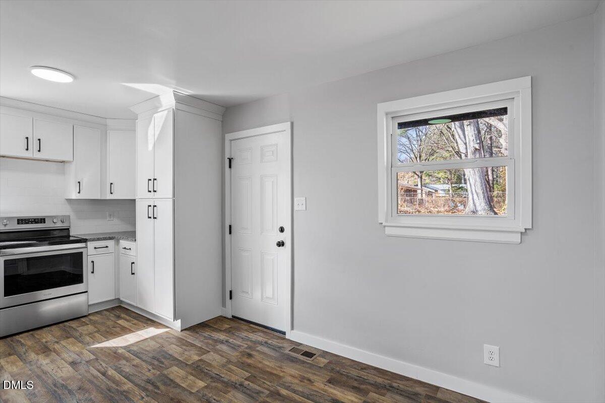 1905 Capps Street Durham, NC 27707 - Photo 11 of 35 a view of a kitchen with wooden floor and electronic appliances