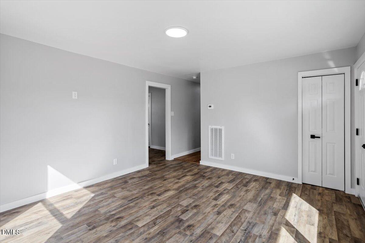 1905 Capps Street Durham, NC 27707 - Photo 6 of 35 a view of an empty room and wooden floor