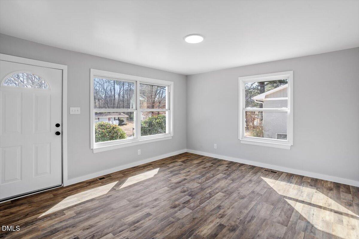 1905 Capps Street Durham, NC 27707 - Photo 8 of 35 a view of empty room with window and wooden floor