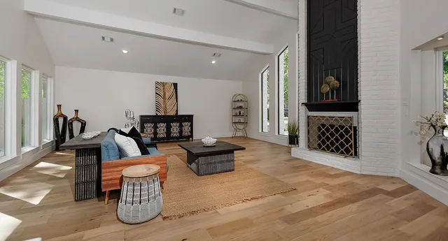 a living room with furniture and a fireplace