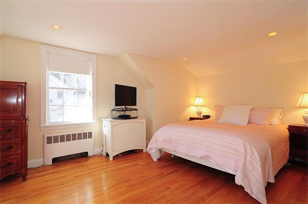 1 Alba Road Wellesley, MA 02481 - Photo 9 of 18 a bedroom with a bed and a tv on the dresser
