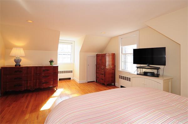 1 Alba Road Wellesley, MA 02481 - Photo 10 of 18 a bedroom with a bed and a flat screen tv