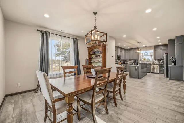 a dining room with furniture and window