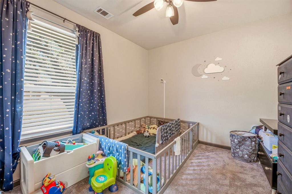 435 Edwards Drive Dublin, TX 76446 - Photo 15 of 40 a bedroom with furniture and a window