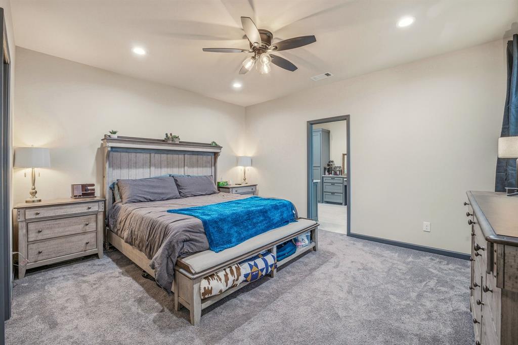 435 Edwards Drive Dublin, TX 76446 - Photo 20 of 40 a bed room with a bed and a ceiling fan
