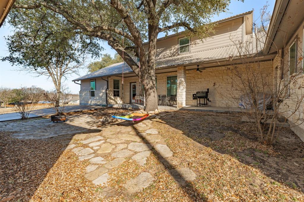 435 Edwards Drive Dublin, TX 76446 - Photo 31 of 40 a view of a backyard with a tree