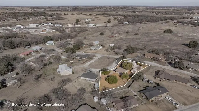 an aerial view of a backyard of a house
