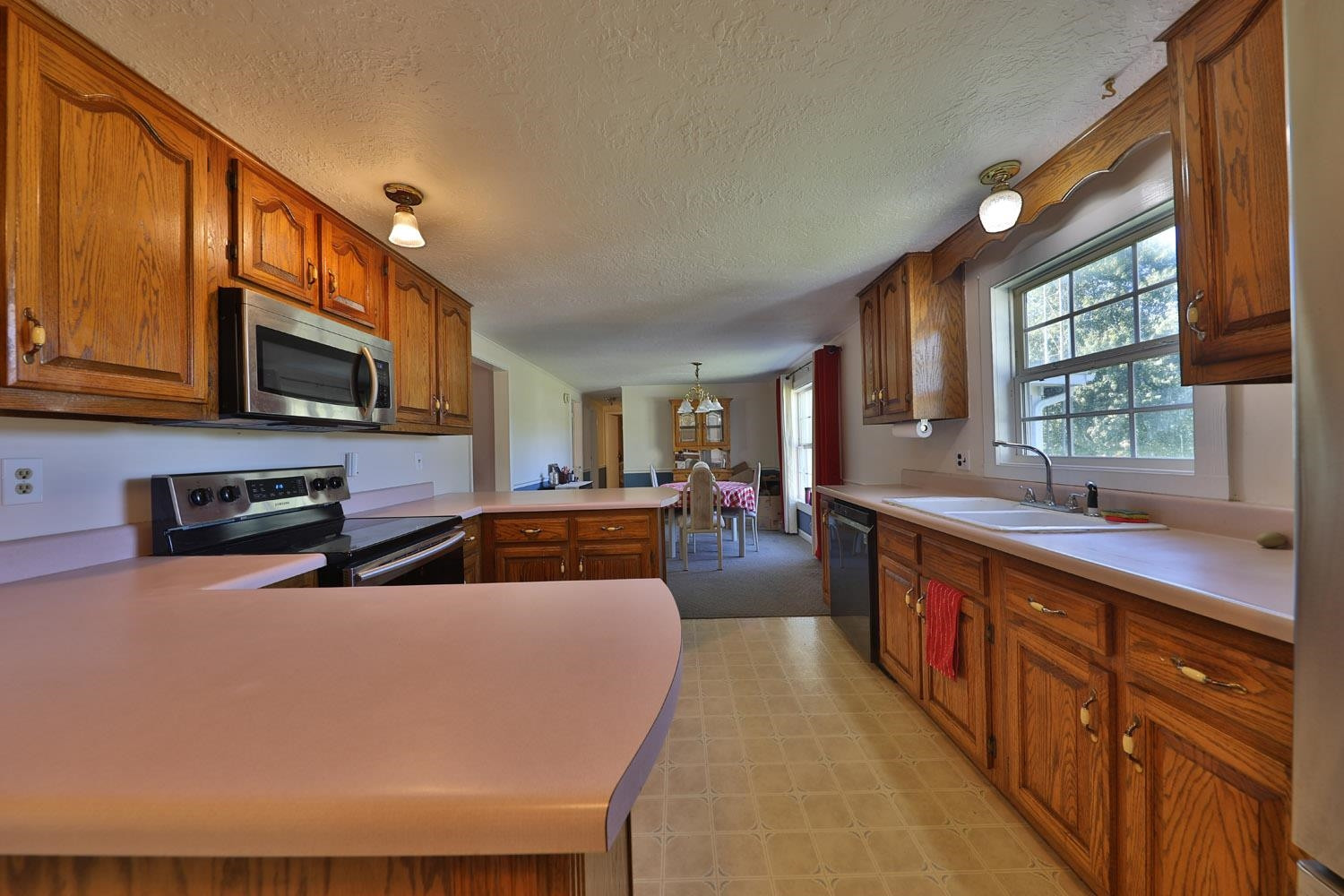 232 Matheny Grove Road Dresden, TN 38225 - Photo 8 of 21 a large kitchen with stainless steel appliances granite countertop a large counter top and a stove top oven