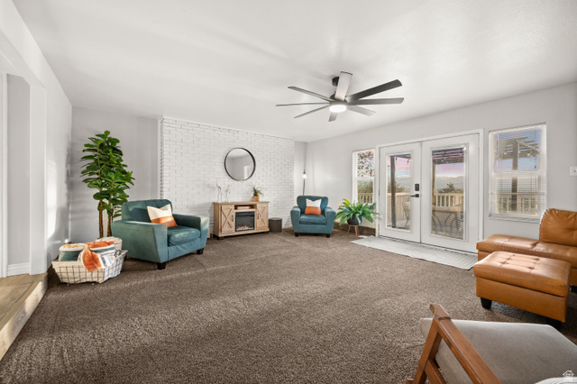 9750 Indian Ridge Drive Sandy, UT 84092 - Photo 33 of 40 Sitting room featuring french doors, a ceiling fan, and carpet flooring