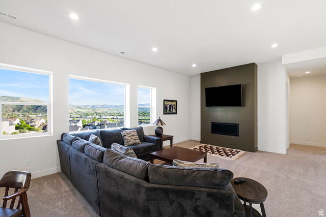 851 Grandview Drive Morgan, UT 84050 - Photo 32 of 68 Spacious living area featuring multiple large windows, recessed lighting, and soft carpeting
