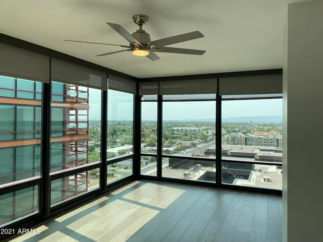a view of an empty room with a large window