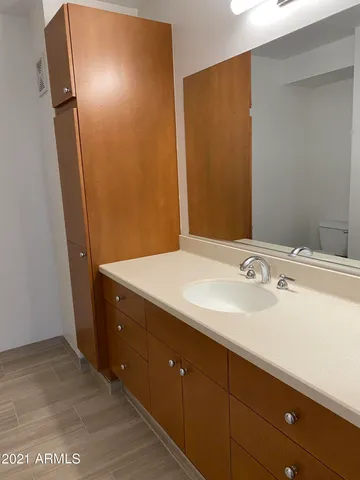 a bathroom with a sink and a mirror