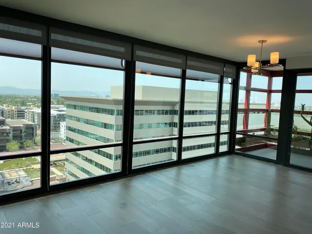 a view of a room with gym equipment and a large window
