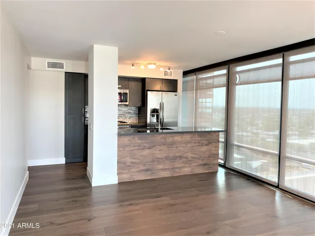 a view of a living room with a large window