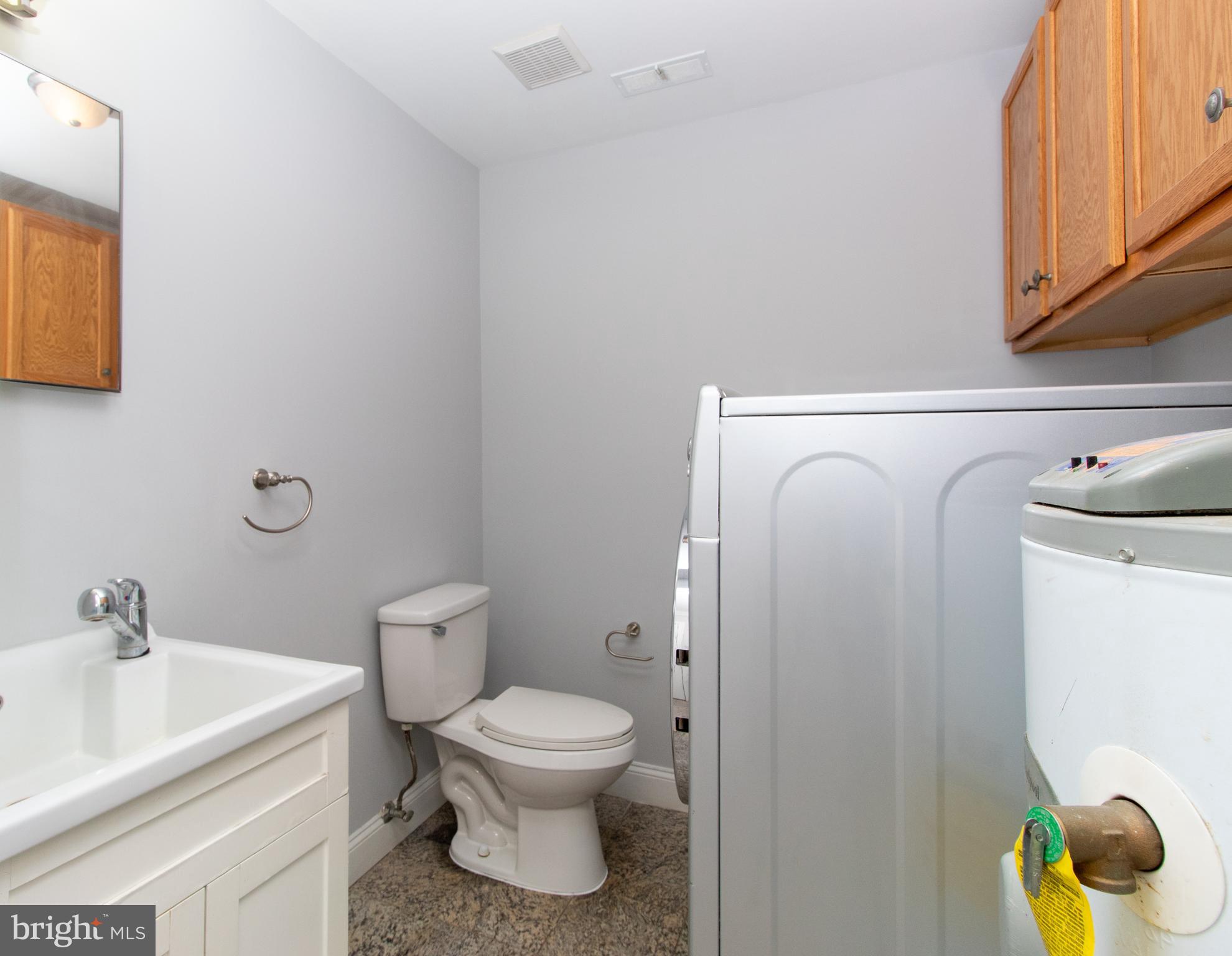 12020 Cross Rd Trail Brandywine, MD 20613 - Photo 15 of 29 1st Floor Half Bath with Laundry