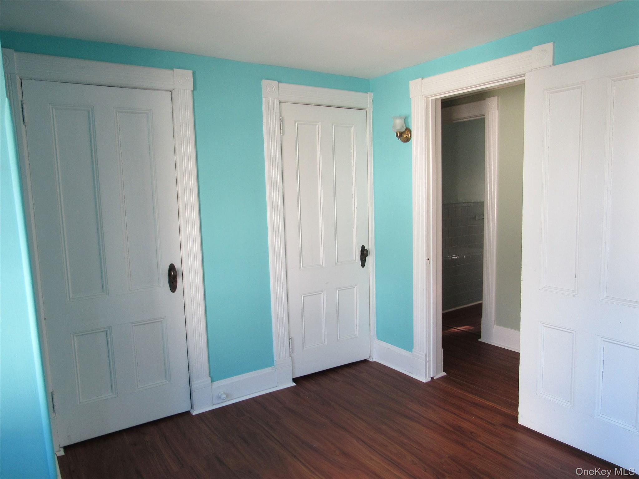98 Main Street Chester, NY 10918 - Photo 21 of 29 an empty room with closet and wooden floor