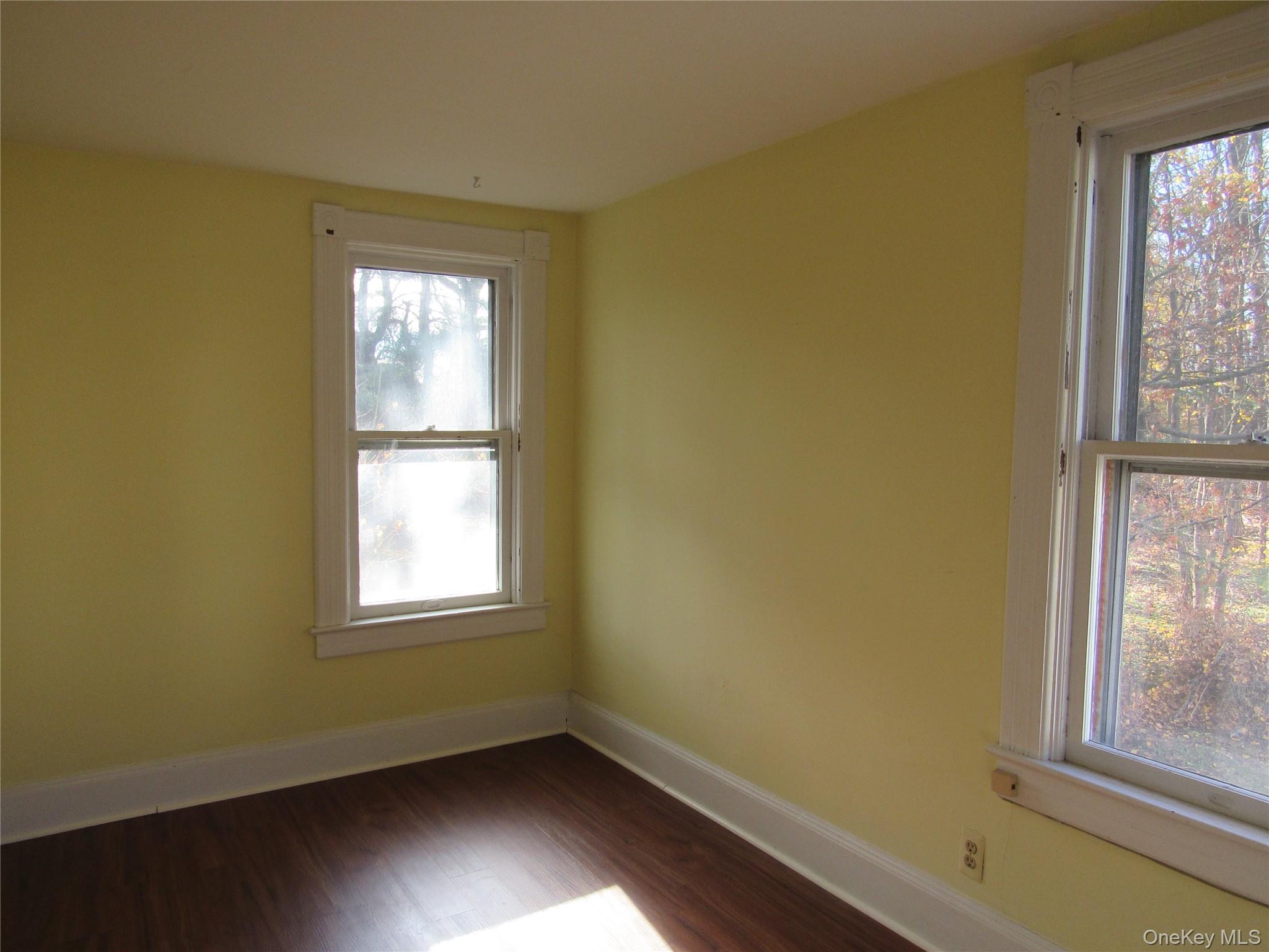 98 Main Street Chester, NY 10918 - Photo 24 of 32 Bedroom #4 with healthy amount of natural light and dark wood finished floors