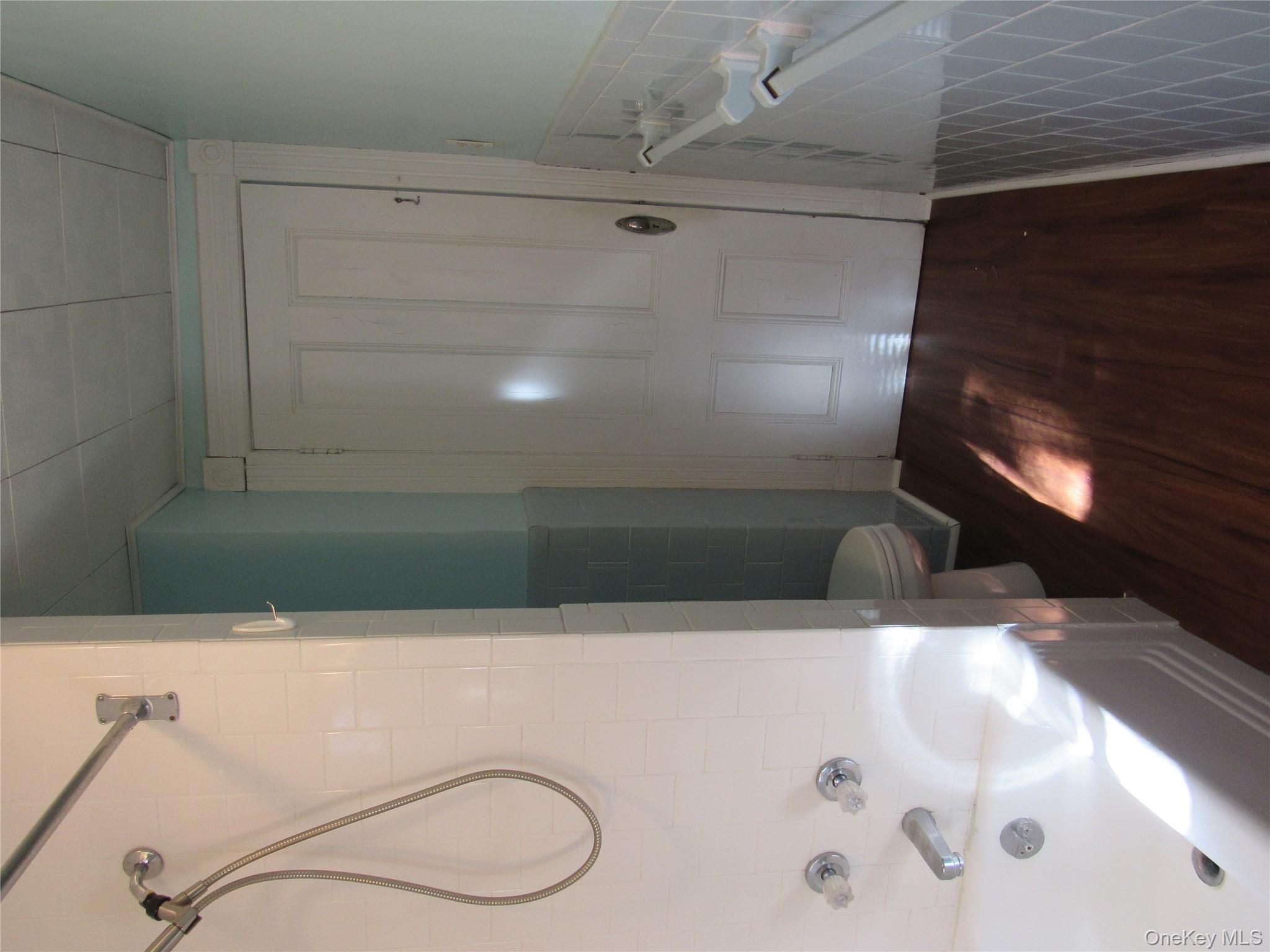 98 Main Street Chester, NY 10918 - Photo 26 of 29 a bathroom with a bathtub and a shower